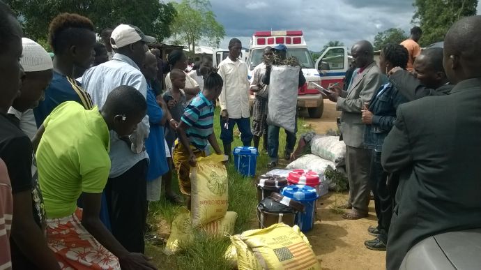 An outreach team from Miller McAllister United Methodist Church, Ganta, Liberia, gather rice, bags of charcoal, buckets with chlorine and soap, drinking water and other food for families infected with Ebola.